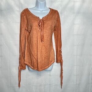 Black Swan orange long sleeve top with lace up front chest and sleeves